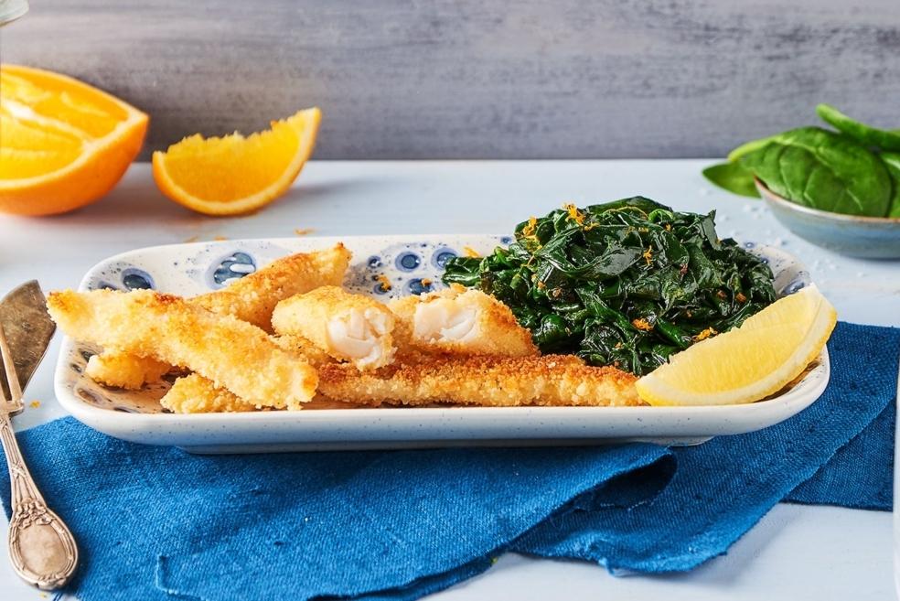 Aiguillettes de merlan pané, tombé d’épinards frais au zeste d’orange
